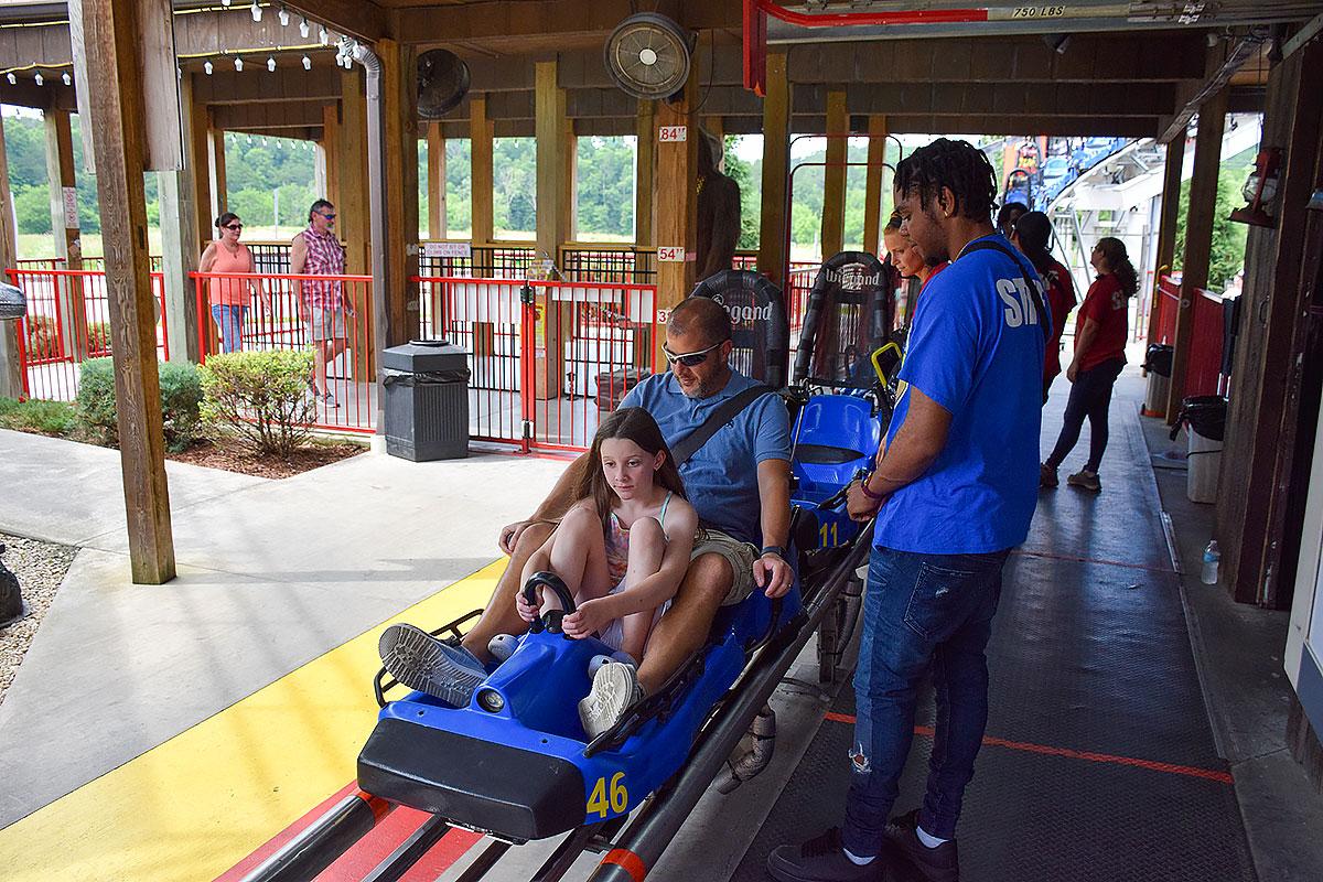 Family enjoying attractions in Wears Valley Tennessee with scenic mountain views